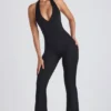 Pema Modal-Jumpsuit mit Spitzenbesatz, Cut-outs und ausgestelltem Schnitt in Schwarz Pema Modal-Jumpsuit mit Spitzenbesatz, Cut-outs und ausgestelltem Schnitt in Schwarz