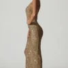 Persephone Verziertes asymmetrisches Cut-Out-Kleid in Gold Persephone Verziertes asymmetrisches Cut-Out-Kleid in Gold