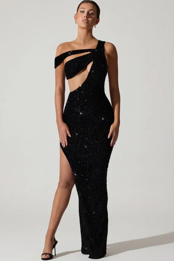 Persephone – Verziertes, asymmetrisches Cut-Out-Kleid in Schwarz Persephone – Verziertes, asymmetrisches Cut-Out-Kleid in Schwarz