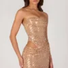 Rania Minikleid mit Cut-outs und Verzierungen in Gold Rania Minikleid mit Cut-outs und Verzierungen in Gold