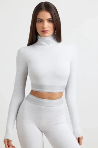 Rückenfreies, langärmeliges Crop-Top mit Rollkragen in Grau meliert