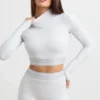 Rückenfreies, langärmeliges Crop-Top mit Rollkragen in Grau meliert Rückenfreies, langärmeliges Crop-Top mit Rollkragen in Grau meliert