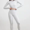 Rückenfreies, langärmeliges Crop-Top mit Rollkragen in Grau meliert Rückenfreies, langärmeliges Crop-Top mit Rollkragen in Grau meliert