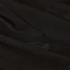 Reese Metallic-Rüschen-Hose mit niedriger Leibhöhe und ausgestelltem Bein in Schwarz Reese Metallic-Rüschen-Hose mit niedriger Leibhöhe und ausgestelltem Bein in Schwarz