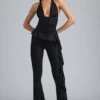 Reese Metallic-Rüschen-Hose mit niedriger Leibhöhe und ausgestelltem Bein in Schwarz Reese Metallic-Rüschen-Hose mit niedriger Leibhöhe und ausgestelltem Bein in Schwarz