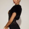 Revia Bolero aus Kunstfell mit kurzen Shorts in Schwarz Revia Bolero aus Kunstfell mit kurzen Shorts in Schwarz