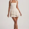 Rosaria Asymmetrisches, mehrlagiges Neckholder-Minikleid in Elfenbein
