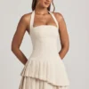 Rosaria Asymmetrisches, mehrlagiges Neckholder-Minikleid in Elfenbein