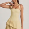 Rosaria Asymmetrisches, mehrlagiges Neckholder-Minikleid in Pastellgelb