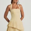 Rosaria Asymmetrisches, mehrlagiges Neckholder-Minikleid in Pastellgelb