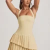 Rosaria Asymmetrisches, mehrlagiges Neckholder-Minikleid in Pastellgelb