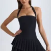 Rosaria asymmetrisches, mehrlagiges Neckholder-Minikleid in Schwarz