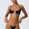 Sanibel Bikinioberteil mit Kettenverzierung und Cut-outs in Schwarz Sanibel Bikinioberteil mit Kettenverzierung und Cut-outs in Schwarz