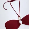 Savai Bikinioberteil mit Rüschen und Metallverzierung in Dark Cherry Savai Bikinioberteil mit Rüschen und Metallverzierung in Dark Cherry