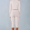 Selene Strick-Caprihose mit mittlerer Leibhöhe in Elfenbein Selene Strick-Caprihose mit mittlerer Leibhöhe in Elfenbein