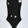 Siana Bodys aus glänzendem Vinyl mit tiefem Ausschnitt in Schwarz Siana Bodys aus glänzendem Vinyl mit tiefem Ausschnitt in Schwarz
