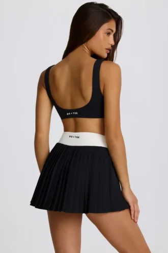 Soft Active Crossover-Minirock mit Falten in Schwarz