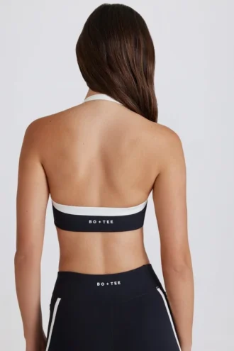 Soft Active Sport-BH mit gedrehter Vorderseite und Neckholder in Schwarz