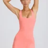 Soft Active Tennis-Kleid mit offenem Rücken in Koralle Soft Active Tennis-Kleid mit offenem Rücken in Koralle