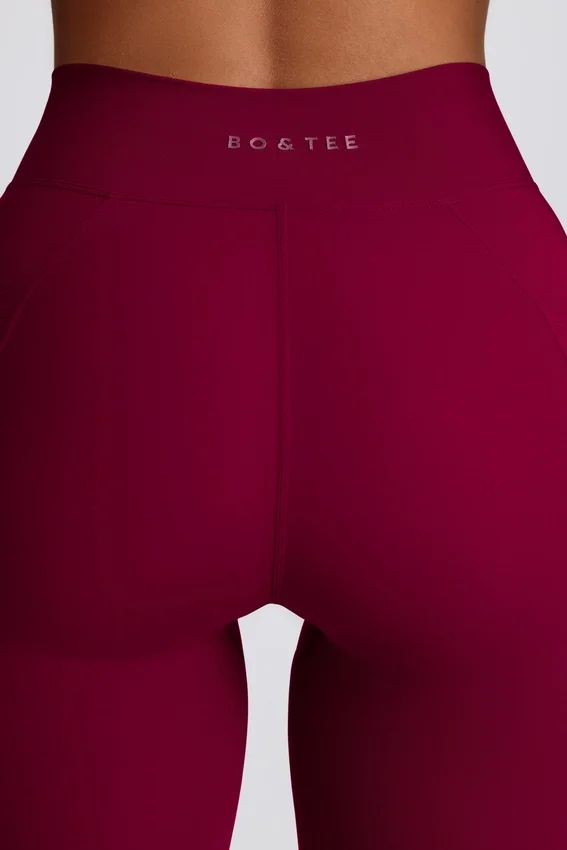 Soft Active V-Taillen-Leggings mit Taschen und ausgestelltem Bein in Burgunderrot Soft Active V-Taillen-Leggings mit Taschen und ausgestelltem Bein in Burgunderrot