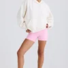 Strukturierter Baumwolljersey-Hoodie mit Grafikprint in Weiß Strukturierter Baumwolljersey-Hoodie mit Grafikprint in Weiß