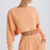 Strukturierter Baumwolljersey-Sweater mit offenem Rücken in Pfirsich Strukturierter Baumwolljersey-Sweater mit offenem Rücken in Pfirsich