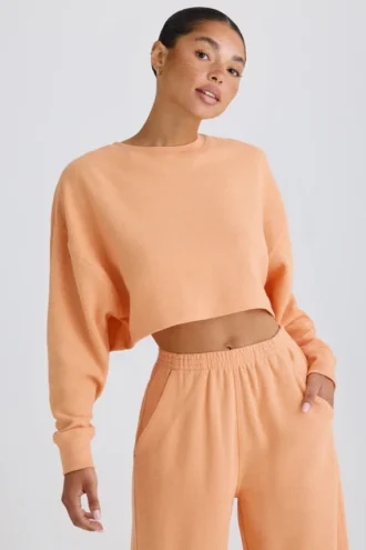 Strukturierter Baumwolljersey-Sweater mit offenem Rücken in Pfirsich