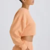 Strukturierter Baumwolljersey-Sweater mit offenem Rücken in Pfirsich Strukturierter Baumwolljersey-Sweater mit offenem Rücken in Pfirsich