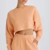 Strukturierter Baumwolljersey-Sweater mit offenem Rücken in Pfirsich Strukturierter Baumwolljersey-Sweater mit offenem Rücken in Pfirsich