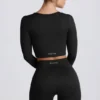 Super Sculpt nahtloses langärmeliges Crop-Top in Schwarz Super Sculpt nahtloses langärmeliges Crop-Top in Schwarz