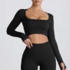 Super Sculpt nahtloses langärmeliges Crop-Top in Schwarz Super Sculpt nahtloses langärmeliges Crop-Top in Schwarz