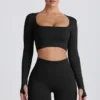 Super Sculpt nahtloses langärmeliges Crop-Top in Schwarz Super Sculpt nahtloses langärmeliges Crop-Top in Schwarz