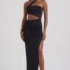 Suvi Maxikleid mit asymmetrischem Ausschnitt, Rüschen und Cut-outs in Schwarz Suvi Maxikleid mit asymmetrischem Ausschnitt, Rüschen und Cut-outs in Schwarz