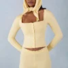 Tahlia Strick-Cardigan mit langen Ärmeln in Buttergelb Tahlia Strick-Cardigan mit langen Ärmeln in Buttergelb