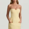 Talina Minikleid mit Herzausschnitt, trägerlos und strukturiert in Pastellgelb Talina Minikleid mit Herzausschnitt, trägerlos und strukturiert in Pastellgelb
