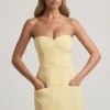 Talina Minikleid mit Herzausschnitt, trägerlos und strukturiert in Pastellgelb Talina Minikleid mit Herzausschnitt, trägerlos und strukturiert in Pastellgelb