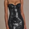 Theodora Premium-Minikleid aus Pailletten-Spitze in Schwarz Theodora Premium-Minikleid aus Pailletten-Spitze in Schwarz