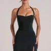 Tula Mid Rise Bodycon Ultra-Mini-Röck mit Schlitz in Schwarz Tula Mid Rise Bodycon Ultra-Mini-Röck mit Schlitz in Schwarz