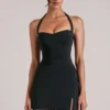 Tula Mid Rise Bodycon Ultra-Mini-Röck mit Schlitz in Schwarz Tula Mid Rise Bodycon Ultra-Mini-Röck mit Schlitz in Schwarz