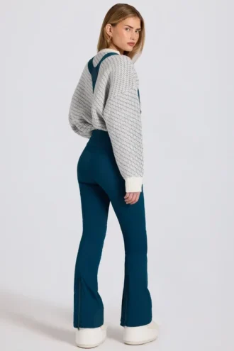 Wasserdichte Latzhose mit hoher Taille und Hosenträgern in Blaugrün