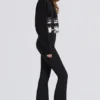 Wasserdichte Latzhose mit hoher Taille und Hosenträgern in Schwarz Wasserdichte Latzhose mit hoher Taille und Hosenträgern in Schwarz