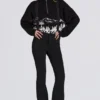 Wasserdichte Latzhose mit hoher Taille und Hosenträgern in Schwarz Wasserdichte Latzhose mit hoher Taille und Hosenträgern in Schwarz
