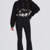 Wasserdichte Latzhose mit hoher Taille und Hosenträgern in Schwarz Wasserdichte Latzhose mit hoher Taille und Hosenträgern in Schwarz
