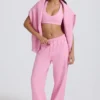Weiche Jogginghose aus Baumwolljersey mit mittlerer Leibhöhe und weitem Bein in Babyrosa Weiche Jogginghose aus Baumwolljersey mit mittlerer Leibhöhe und weitem Bein in Babyrosa